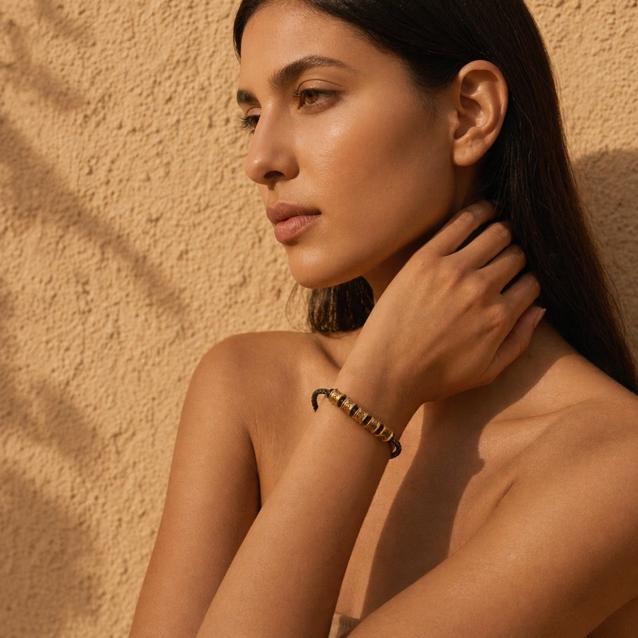 Luck Comes bracelet in warm sunlight
